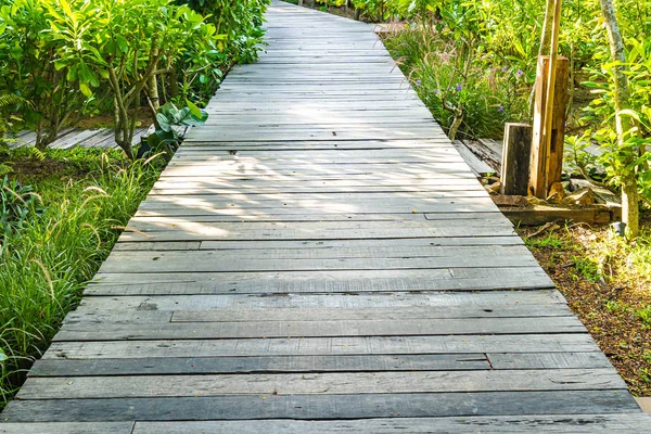 Beautiful wooden path walk in the garden