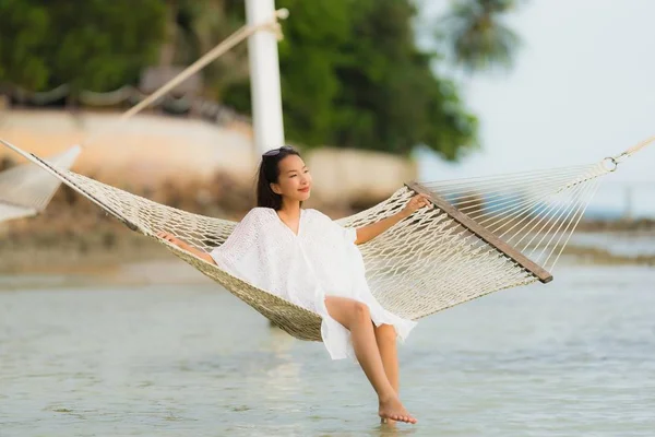 Portrait beautiful young asian woman sitting on hammock around s — Stock Photo, Image