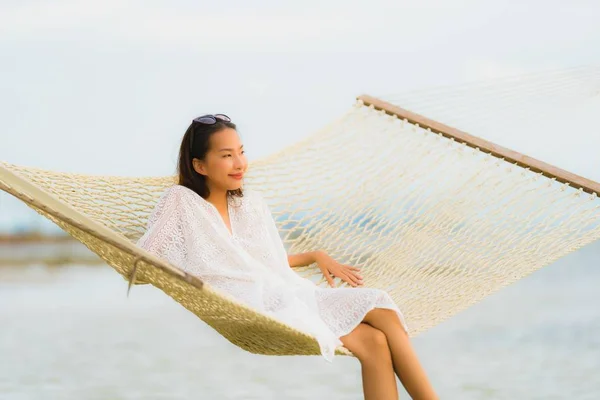 Portrait beautiful young asian woman sitting on hammock around s — Stock Photo, Image