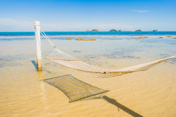 Beautiful empty hammock around tropical beach sea ocean for holi
