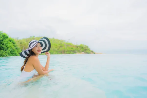 Portrait young asian woman relax smile happy around outdoor swim — Stock Photo, Image