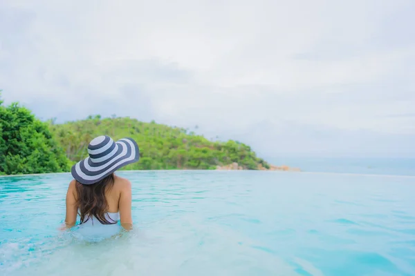 Portrait young asian woman relax smile happy around outdoor swim — Stock Photo, Image