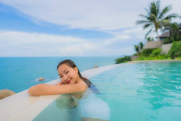 Portrait young asian woman relax smile happy around outdoor swim — Stock Photo, Image