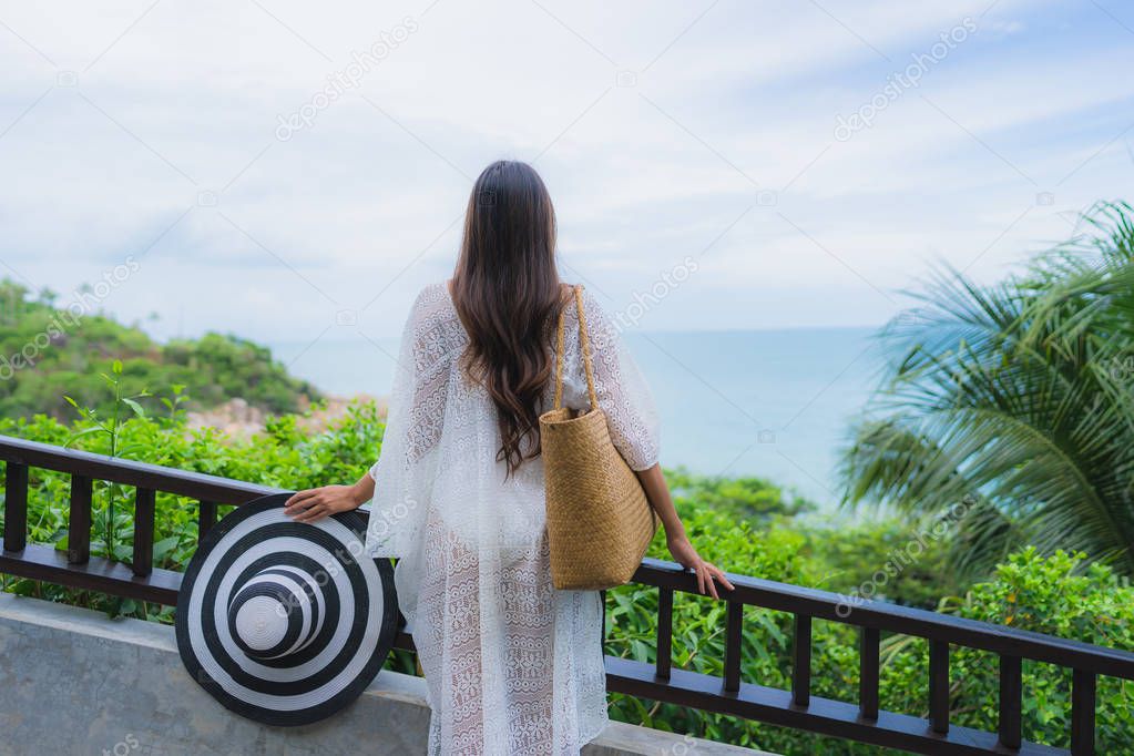 Portrait beautiful young asian woman looking sea beach ocean for