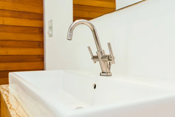 Faucet or water tap and white sink or washbasin decoration in ba — Stock Photo, Image