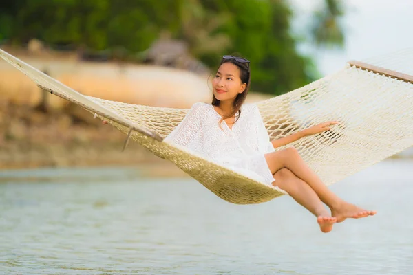 Portrait beautiful young asian woman sitting on hammock around s — Stock Photo, Image