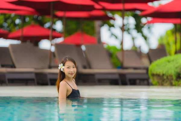 Portrait young asian woman relax smile happy around outdoor swim — Stock Photo, Image