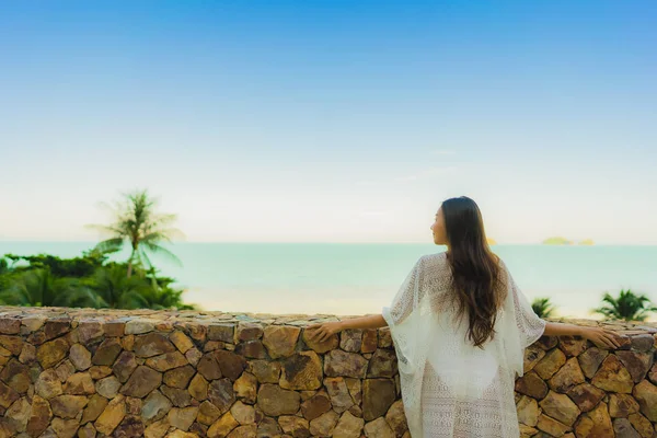 Portrait beautiful young asian woman looking sea beach ocean for — Stock Photo, Image