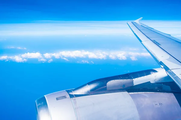 Aerial view of airplane wing with blue sky — Stock Photo, Image