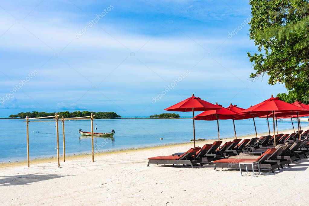 Beautiful outdoor tropical beach sea ocean with umbrella chair a