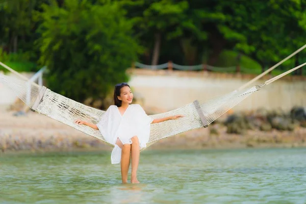 Portrait beautiful young asian woman sitting on hammock around s — Stock Photo, Image