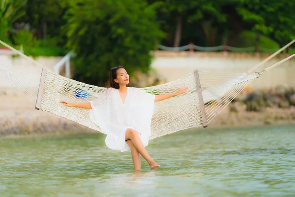 Portrait beautiful young asian woman sitting on hammock around s — Stock Photo, Image