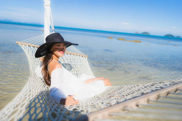 Portrait beautiful young asian woman sitting on hammock around s — Stock Photo, Image