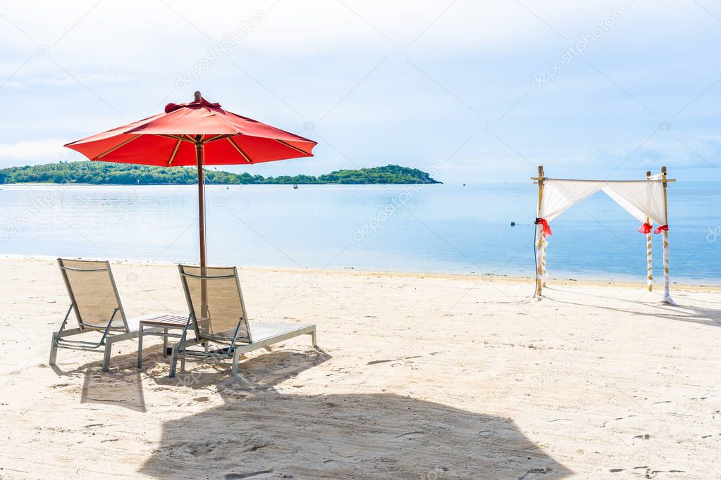 Beautiful outdoor tropical beach sea ocean with umbrella chair a