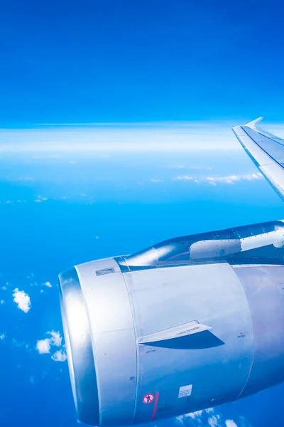 Aerial view of airplane wing with blue sky — Stock Photo, Image