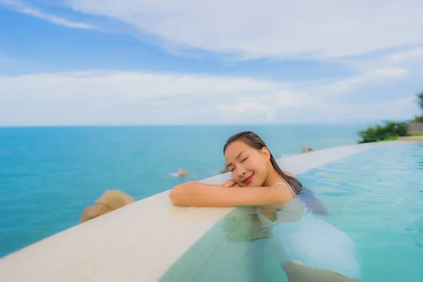 Portrait young asian woman relax smile happy around outdoor swim — Stock Photo, Image