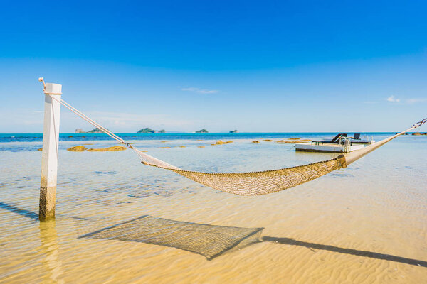 Beautiful empty hammock around tropical beach sea ocean for holi