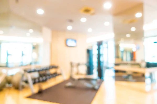 Abstrakt oskärpa och oskärpa fitnessutrustning i gymmet rum interiör — Stockfoto