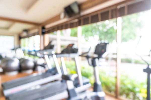 Abstract Blur en Defocus fitnessapparatuur in Gym kamer interieur — Stockfoto