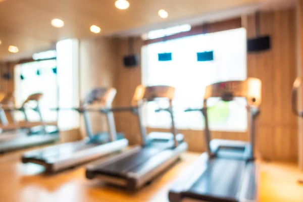 Abstract Blur en Defocus fitnessapparatuur in Gym kamer interieur — Stockfoto