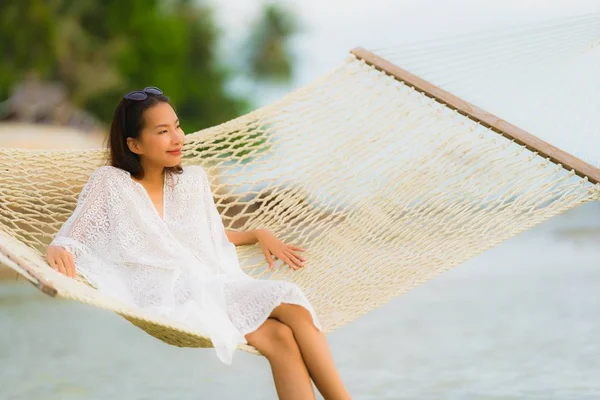 Portrait beautiful young asian woman sitting on hammock around s — Stock Photo, Image