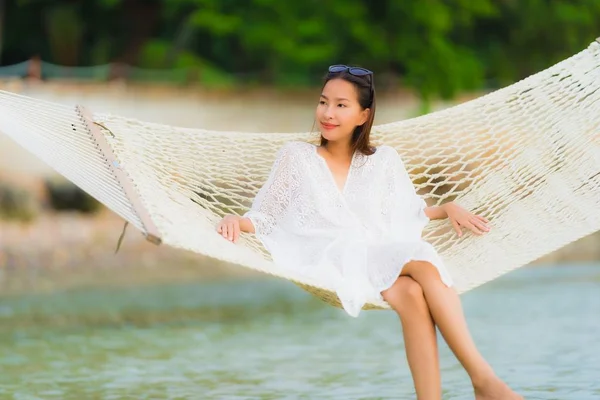 Portrait beautiful young asian woman sitting on hammock around s — Stock Photo, Image