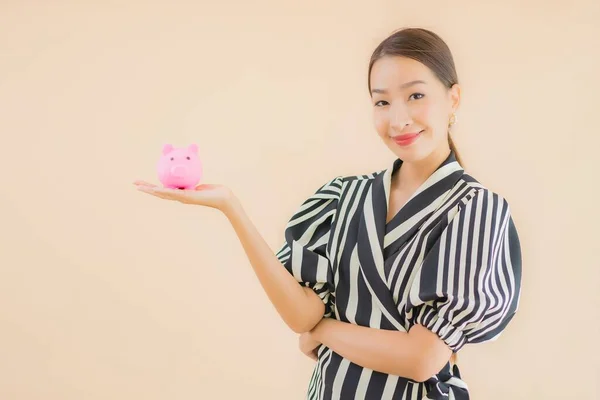 Portrait Beautiful Young Asian Woman Pink Piggy Bank Brown Background — Stock Photo, Image