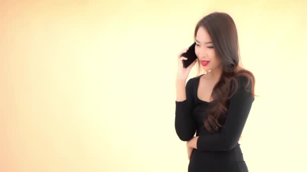 Close Footage Beautiful Young Asian Woman Using Smartphone Isolated Yellow — Stock Video