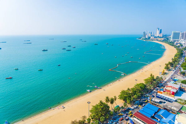 Beautiful tropical beach sea ocean bay around white cloud blue sky and architecture building in Pattaya city Thailand