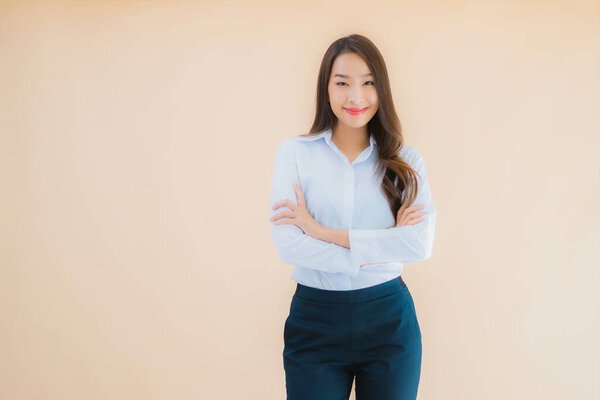 Portrait beautiful young asian business woman in action on isolated color background