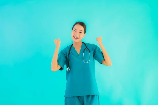 Portrait beautiful young asian doctor woman happy smile for work in hospital and clinic on blue isolated background