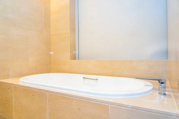 Empty luxury bathtub with water faucet decoration interior of bathroom