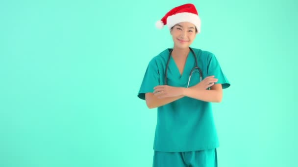 Footage Beautiful Young Asian Doctor Stethoscope Santa Hat Isolated Blue — Stock Video