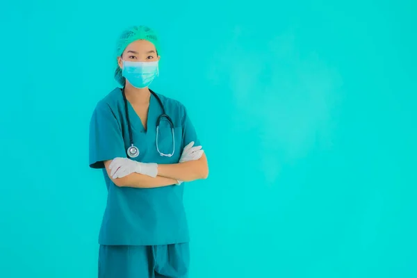 Portrait beautiful young asian doctor woman with mask and eyeglassses for protect from covid19 or coronavirus on blue isolated background