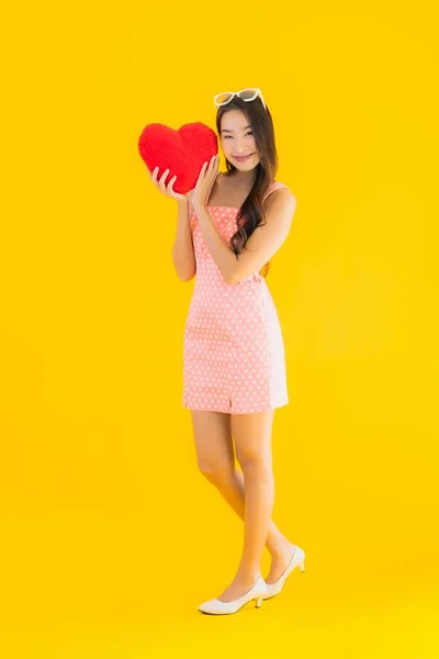 Portrait Beautiful Young Asian Woman Heart Pillow Sign Yellow Isolated — Stock Photo, Image