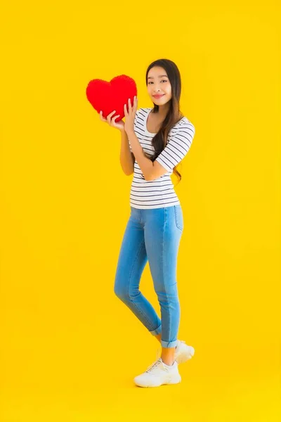 Portrait Beautiful Young Asian Woman Show Heart Pillow Yellow Isolated — Stock Photo, Image