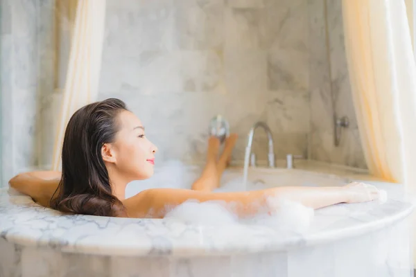 Portrait beautiful young asian woman relax take a bath in bathtub in bathroom interior