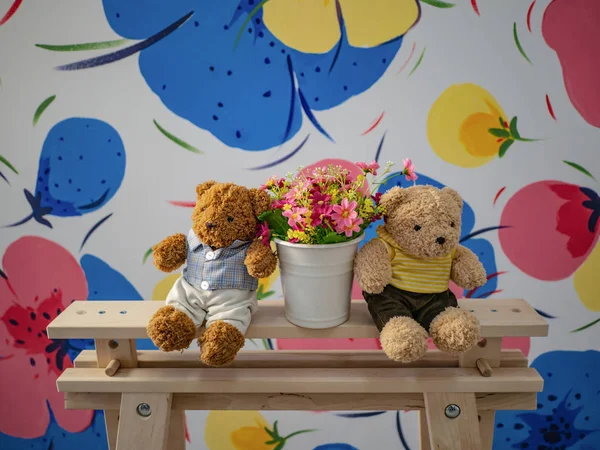 Teddy bear and flowers with beautiful backgroun