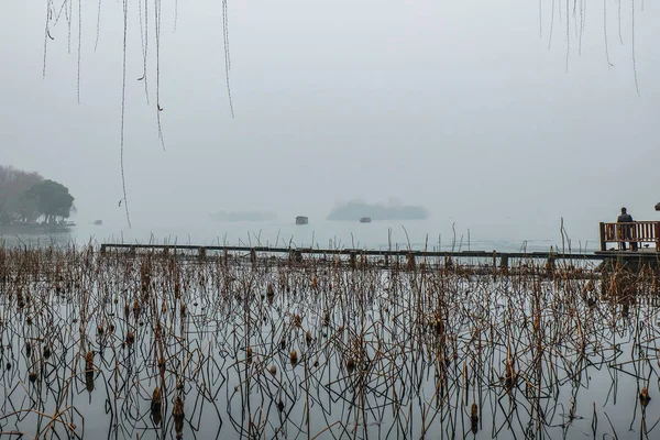 Beautiful Xihu lake(West Lake) with foggy or mist in winter season,hangzhou chin
