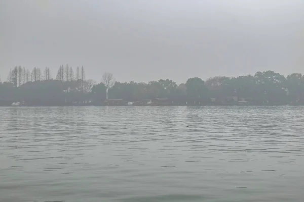 Beautiful Xihu lake(West Lake) with foggy or mist in winter season