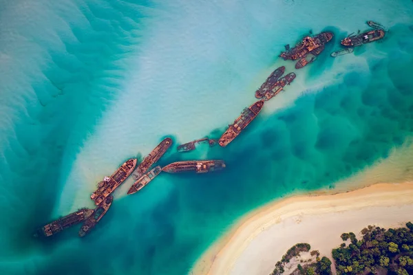 stock image The Tangalooma Wrecks used to be 15 steam driven barges which were deliberately sunk in 1963 along the Moreton Island coastline to form a breakwall so that small boats can anchor in shelter