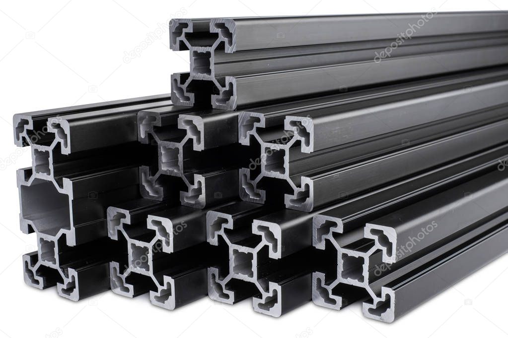 stack of black anodized aluminum extrusion bars, isolated white 