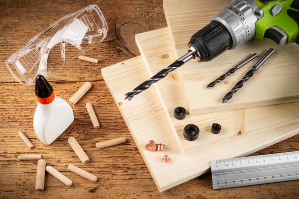 Wooden Dowel Joint Pins Drill Glue Wood Planks Safety Glasses — Stock Photo, Image