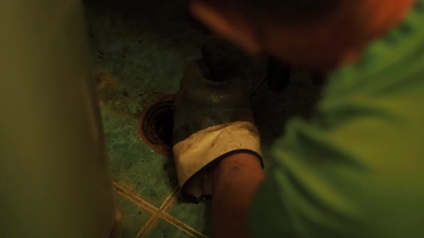 Man Working Rubber Gloves Pushes Metal Cable Hole Floor Man — Stock Video