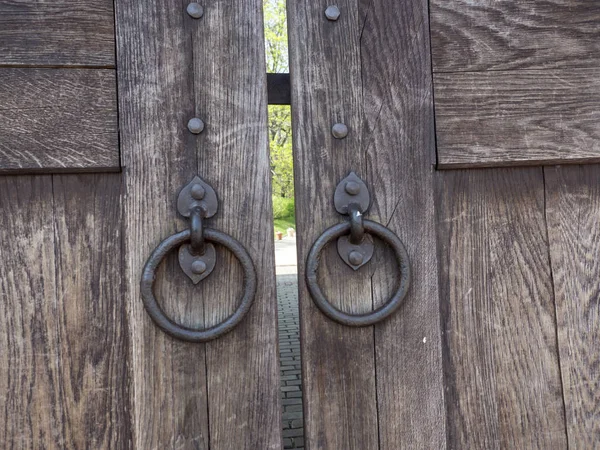 Old Wooden Gate with wrought iron rings