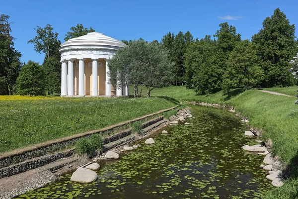 Temple of Friendship in Pavlovsk Park at a turn of the river Slavyanovka, Saint Petersburg, Russia. The temple was built in 1781-1784 by design of architect Charles Cameron. Pavlovsk Park is the public park with free access.
