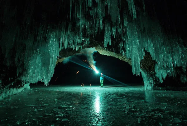 Lake Baikal. Torch light in the grotto of the island of Kharantsy