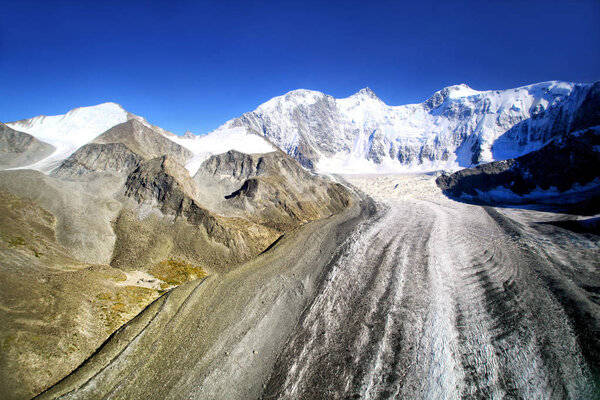 Crown of Altai-Belukha mountain, height 4506 meters. Katun ridge. Aerial photography.