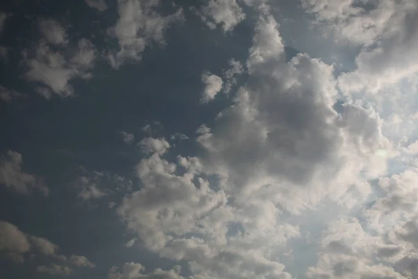 The calm tones of an evening sky is beautifully expressed in these clouds, their edges light and fluffy wind carried them through the skies towards sunset