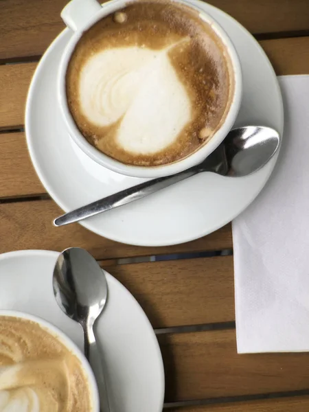 Overhead view of cappuccino with heart shaped foam